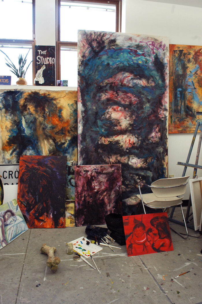 Display of several abstract paintings.