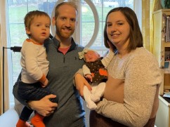 Nate and Ashley Smith holding toddler and new baby