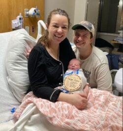 School of Pharmacy alumna Danielle Baker, husband, and newborn baby