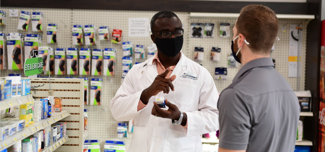 Pharmacist assisting a customer