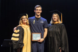 male graduate receiving award