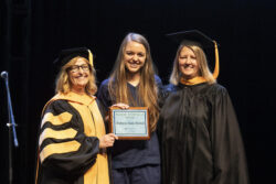 female graduate receiving award